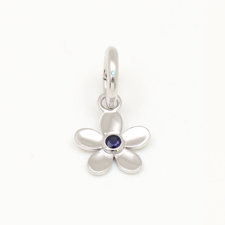 DIVETIA Daisy Day charm with lab-grown sapphire in rhodium-finished sterling silver, front view