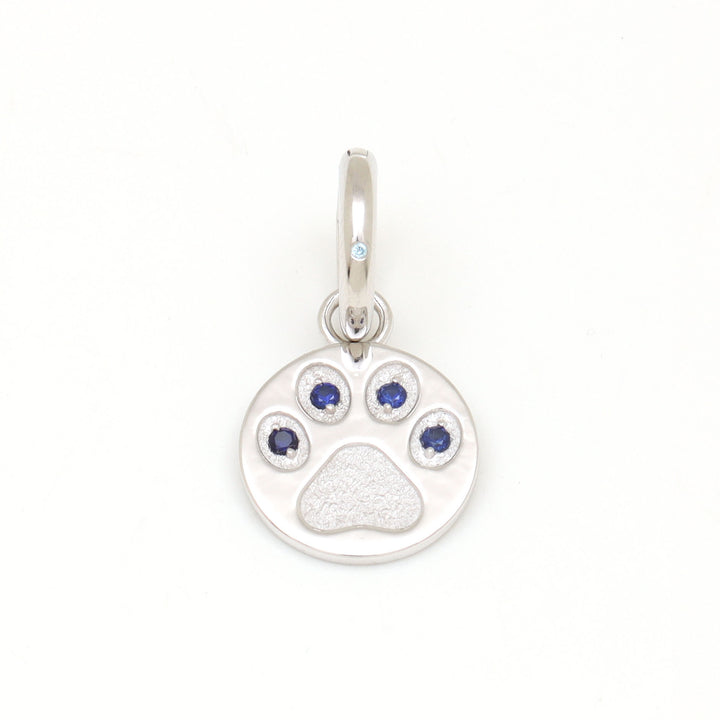 DIVETIA Paw Promise charm with lab-grown sapphire in rhodium-finished sterling silver, front view