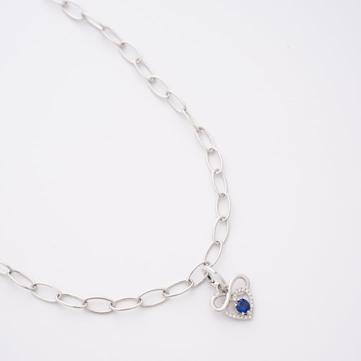 Endless sapphire charm on the DIVETIA Rolo Necklace
