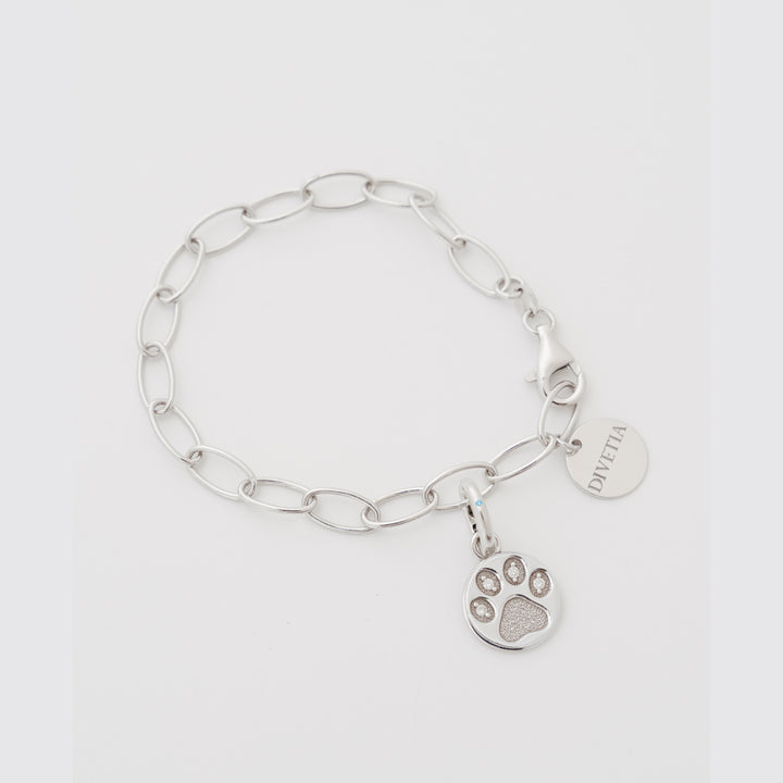Paw Promise white diamond charm on the DIVETIA Rolo Bracelet